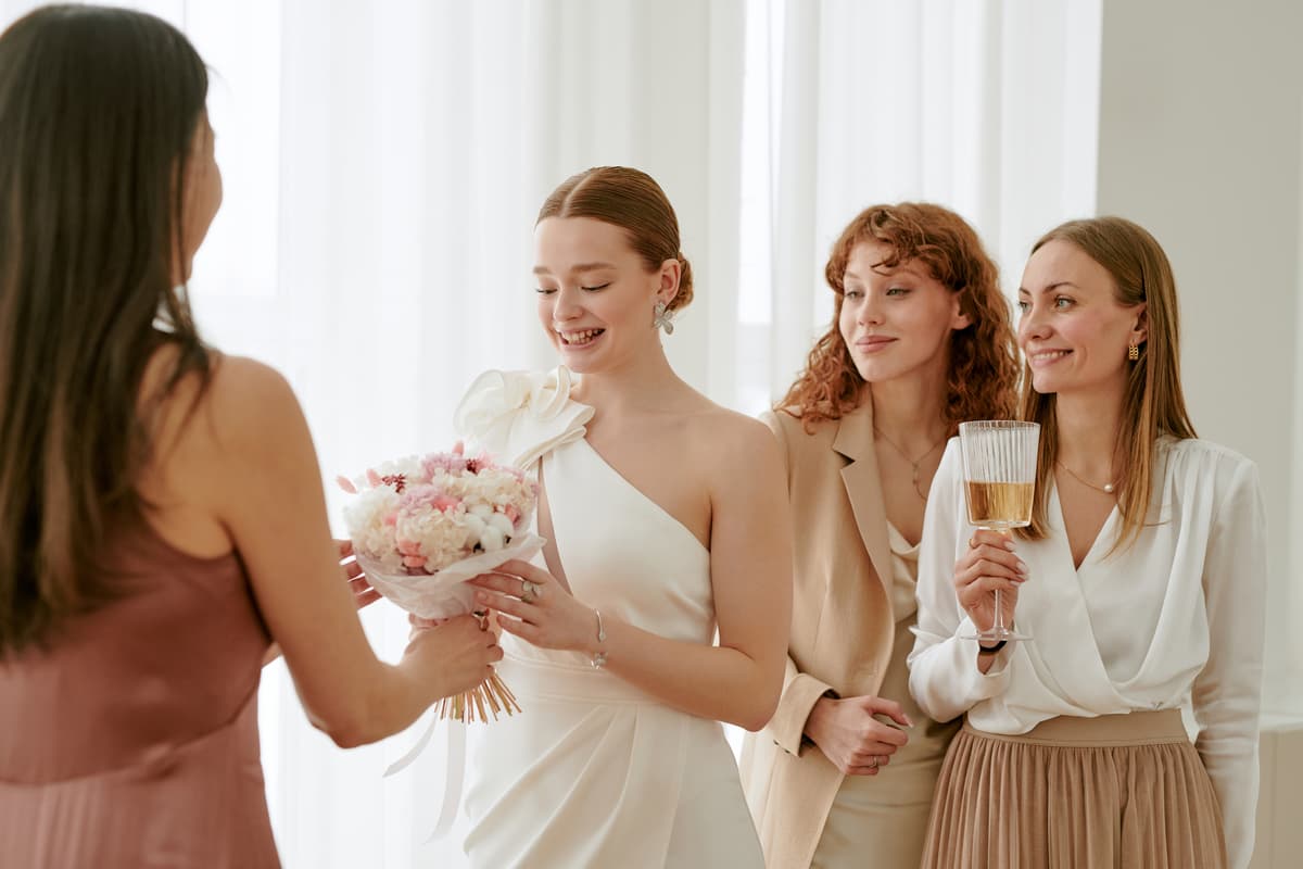 Bride getting ready with fragrance for wedding day